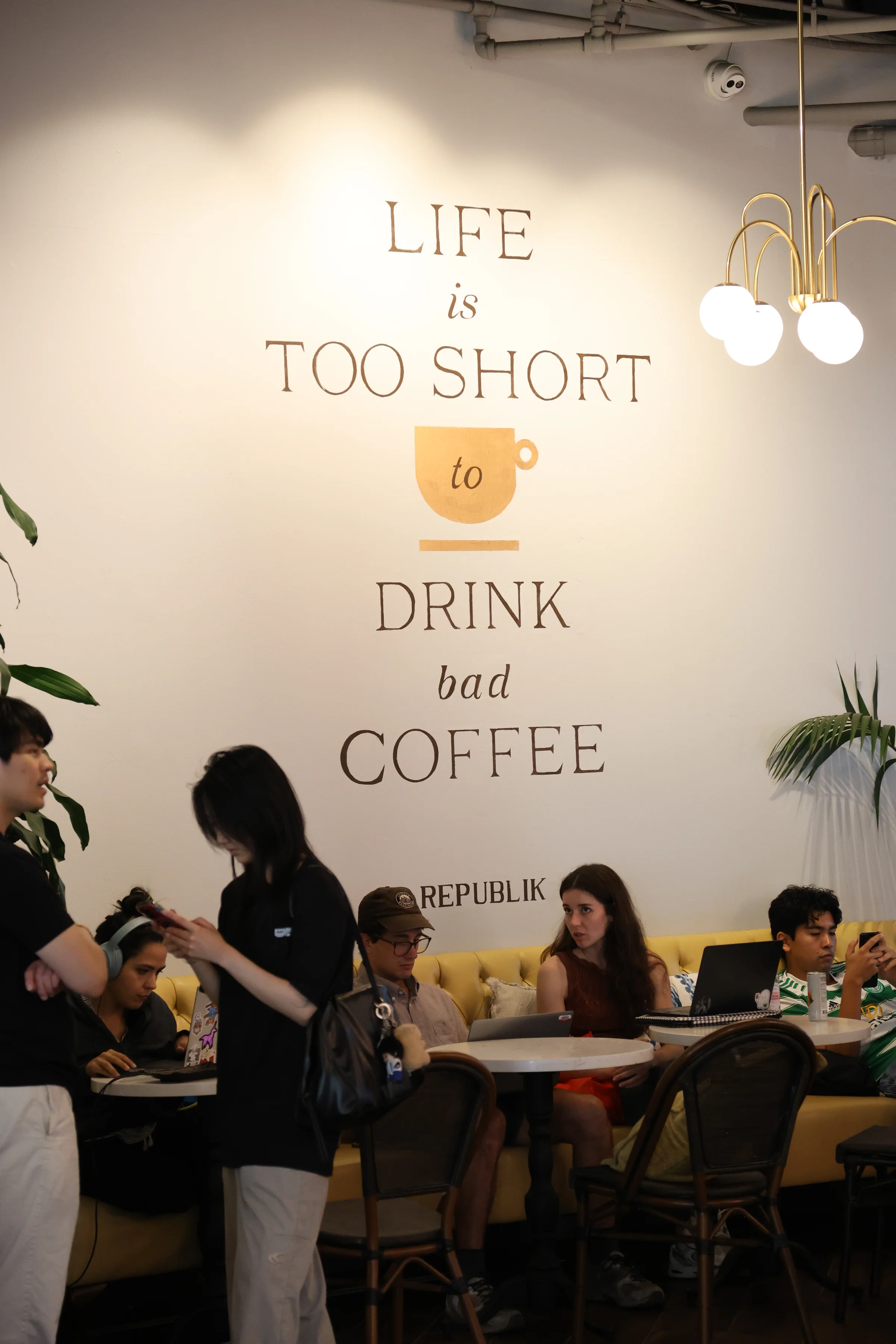 Customers at tables inside Republik Coffee